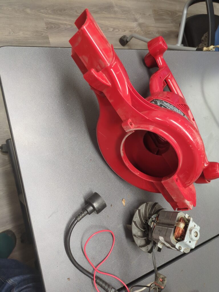 A disassembled leaf blower