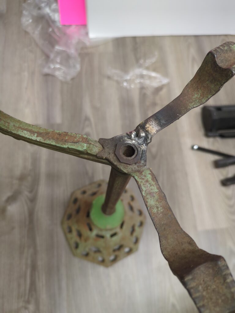 The smoking stand with the prong welded back on. It's a beautiful weld.