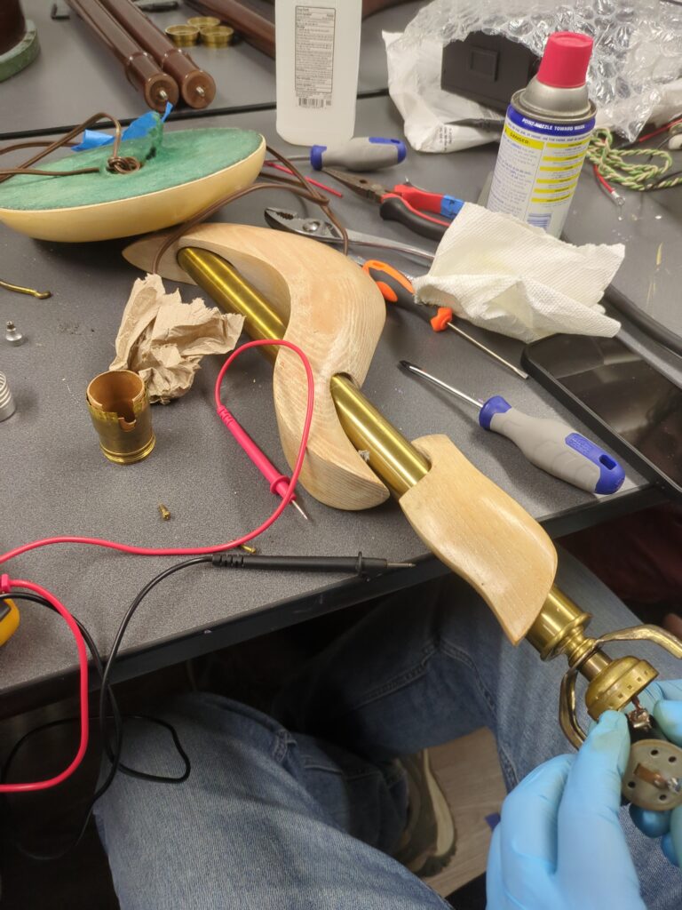 A nice lamp that wouldn't turn on is disassembled on the table. It left the Makerspace fully operational. Lamps are a common repair item at the Repair Cafe, and we have an excellent success rate at getting them working again.